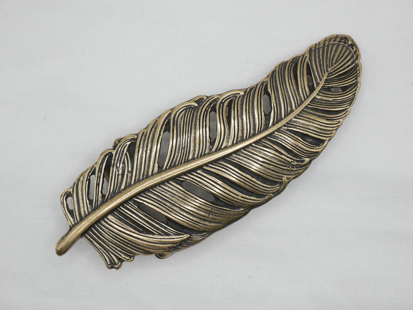 HEBILLA PLUMA