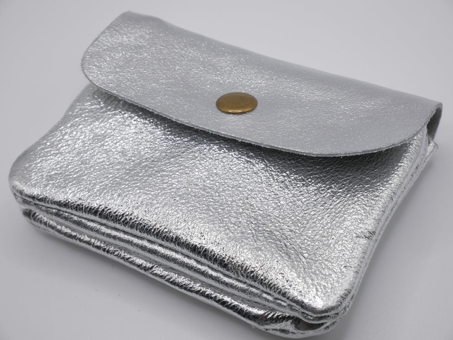 CARTERA ROCK PLATEADA